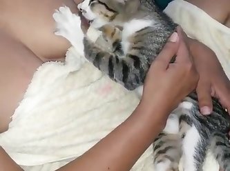 99315 A Woman Breastfeeding A Kitten